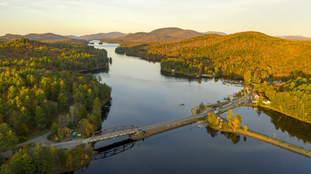 Sunset over Highway 30 Crossing Long Lake at Adirondacks Park Upstate NY