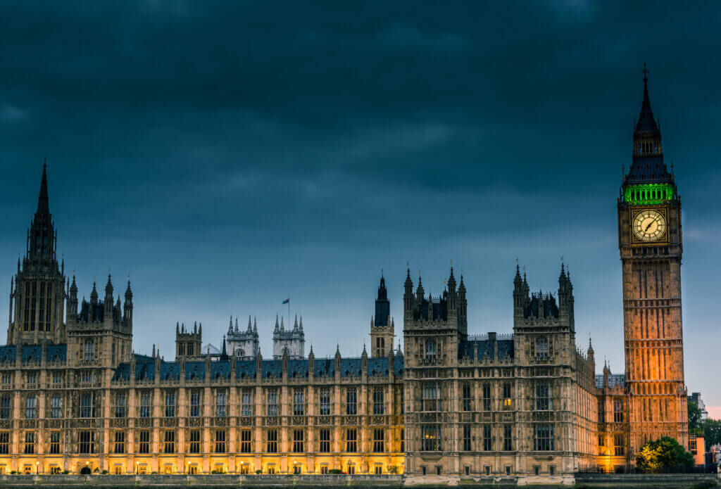 Westminster abbey and big ben in the London skyline at night