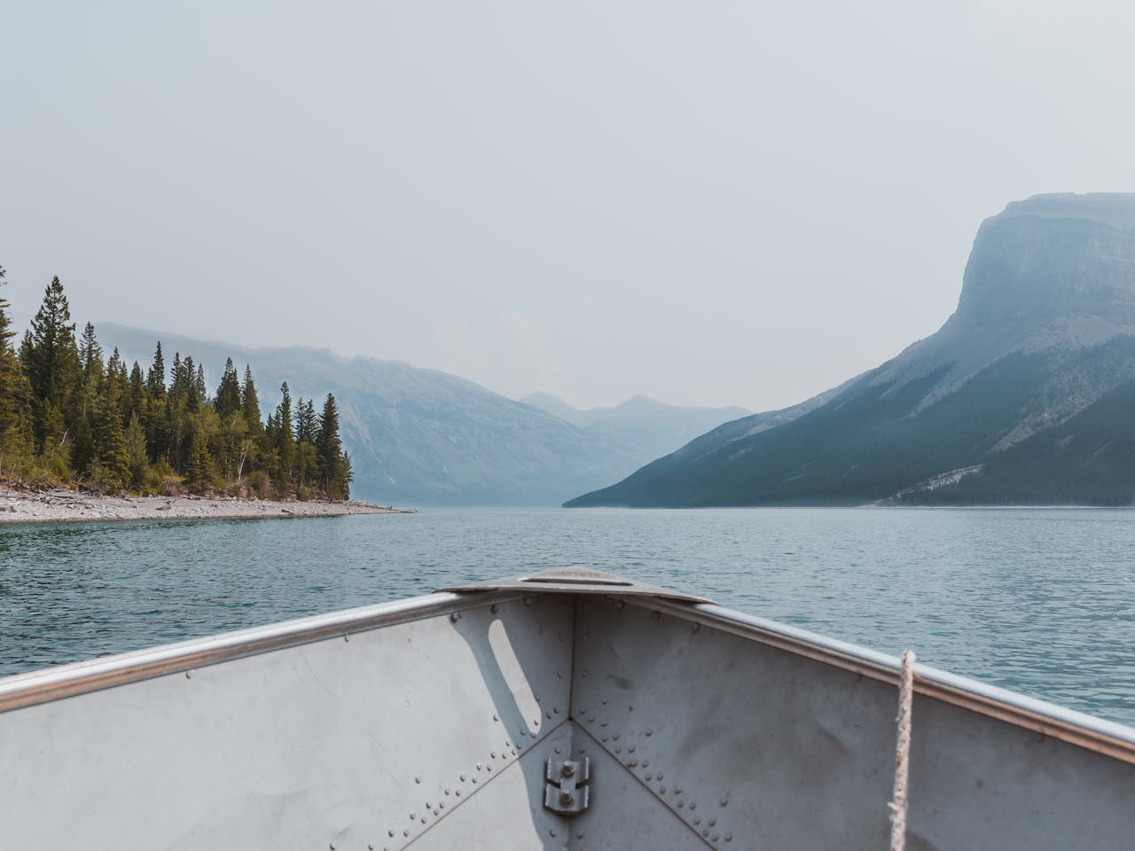 Boat tip floating on rippling river in picturesque highlands